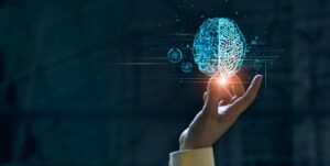 Une main avec un cerveau digitalisé au dessus
